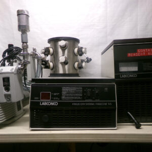 Freeze dryer and vacuum pump on table.