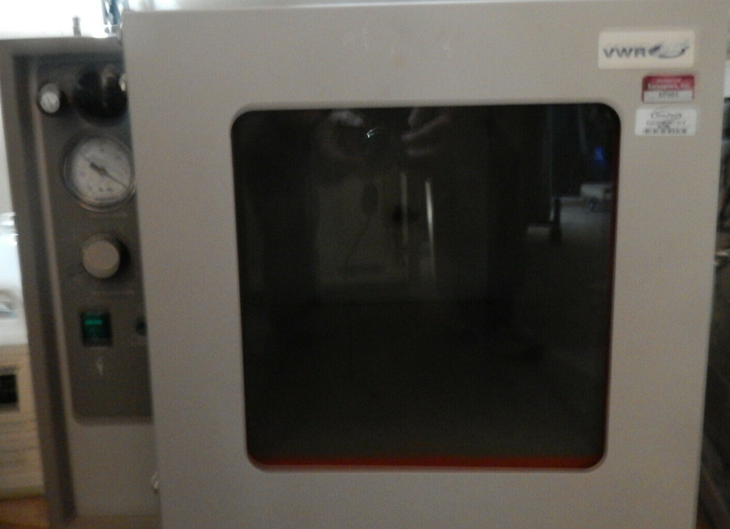 A laboratory oven with a glass door.