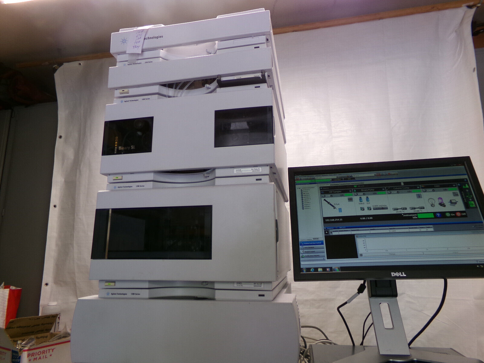 A stack of lab equipment with a computer.