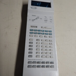 A white electronic device with a screen and many buttons.