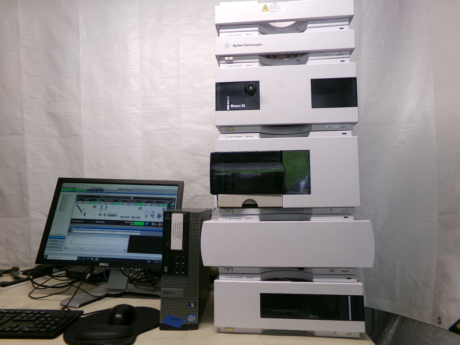 A stack of lab equipment with a computer.