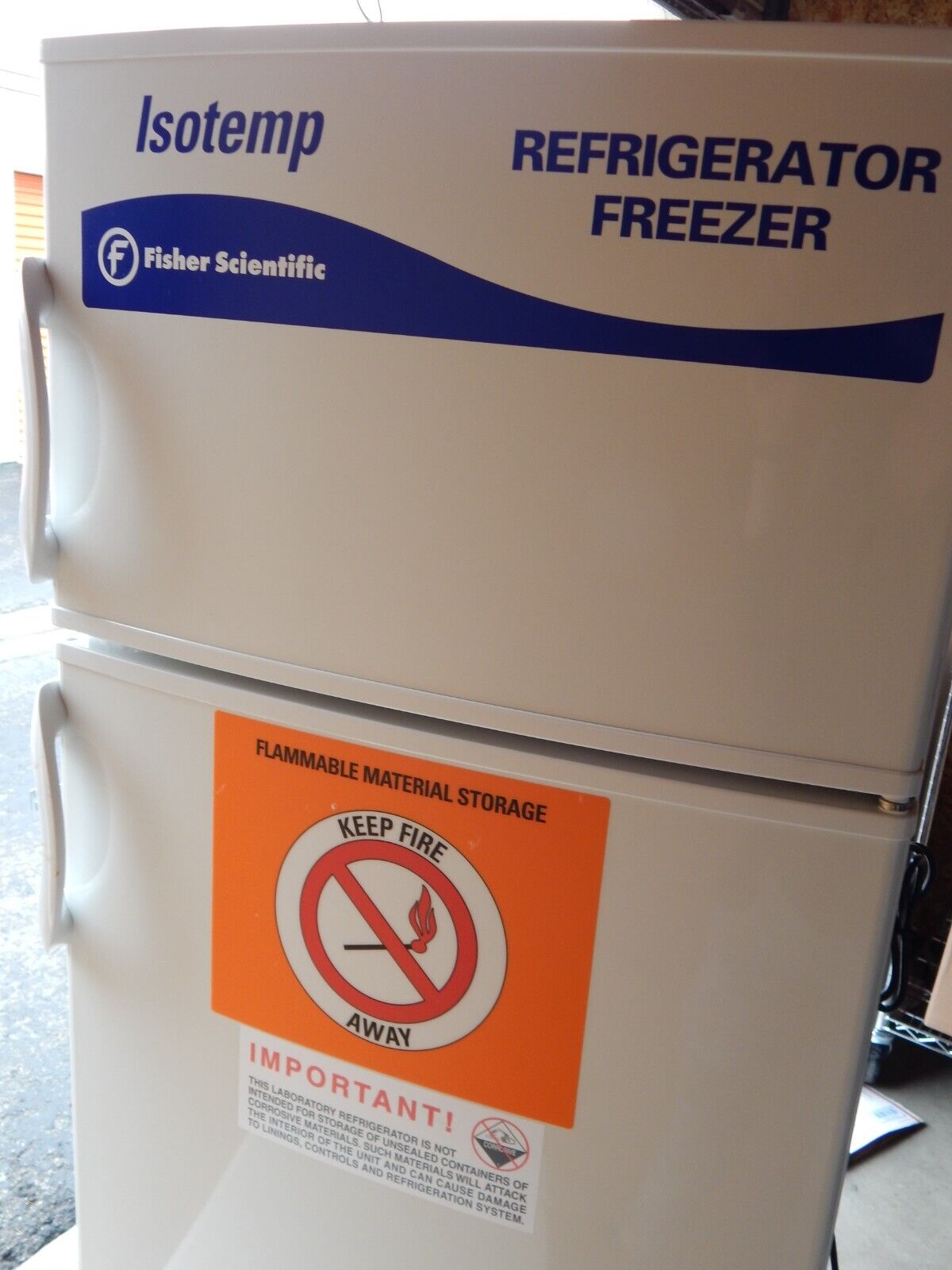 A white Isotemp refrigerator freezer.