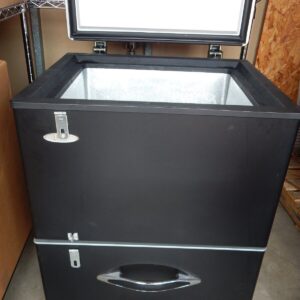 Black chest freezer with two drawers.