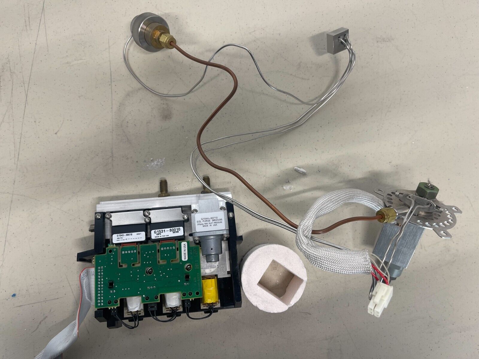 A disassembled view of a Swagelok analytical gas purifier.