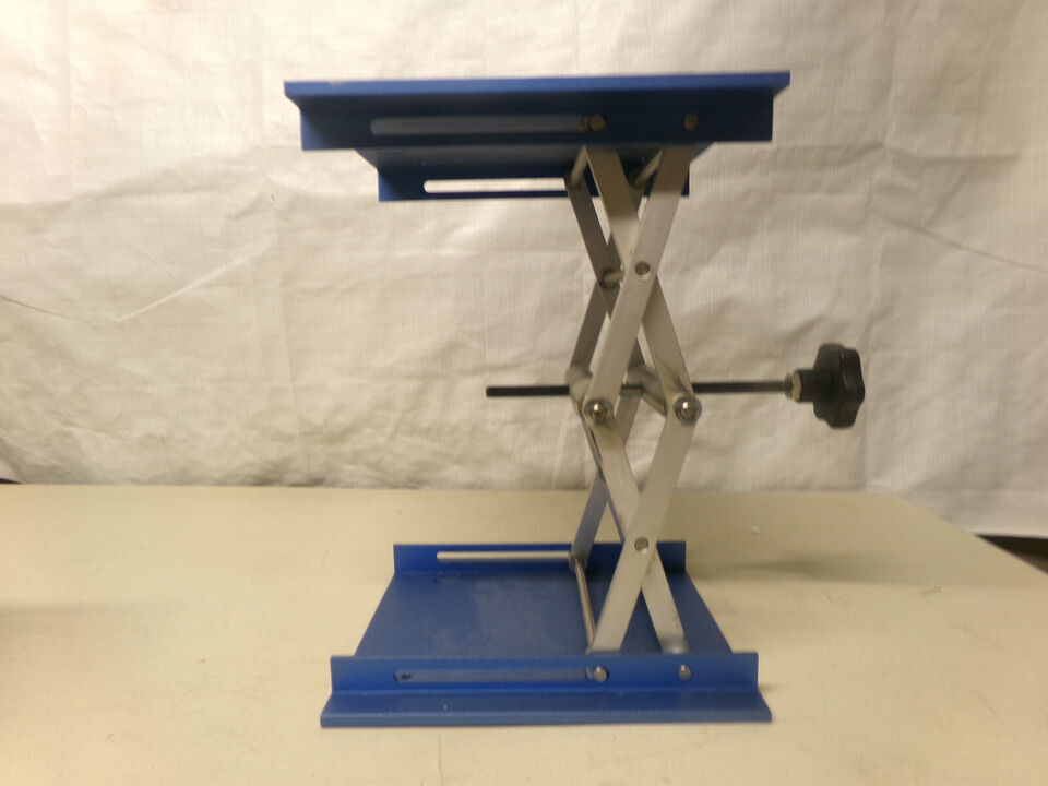 Blue and silver scissor lift table.